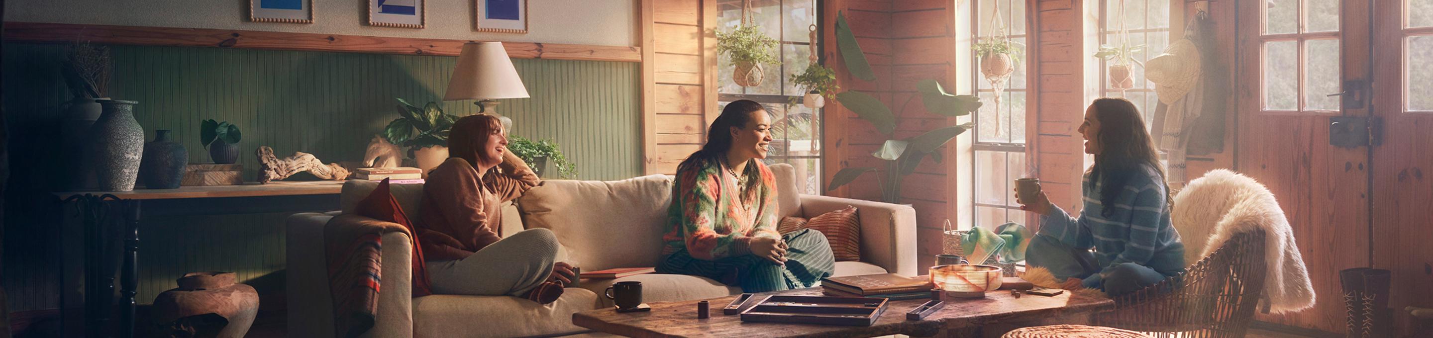 Lauren, a real patient, talking with friends in a living room.